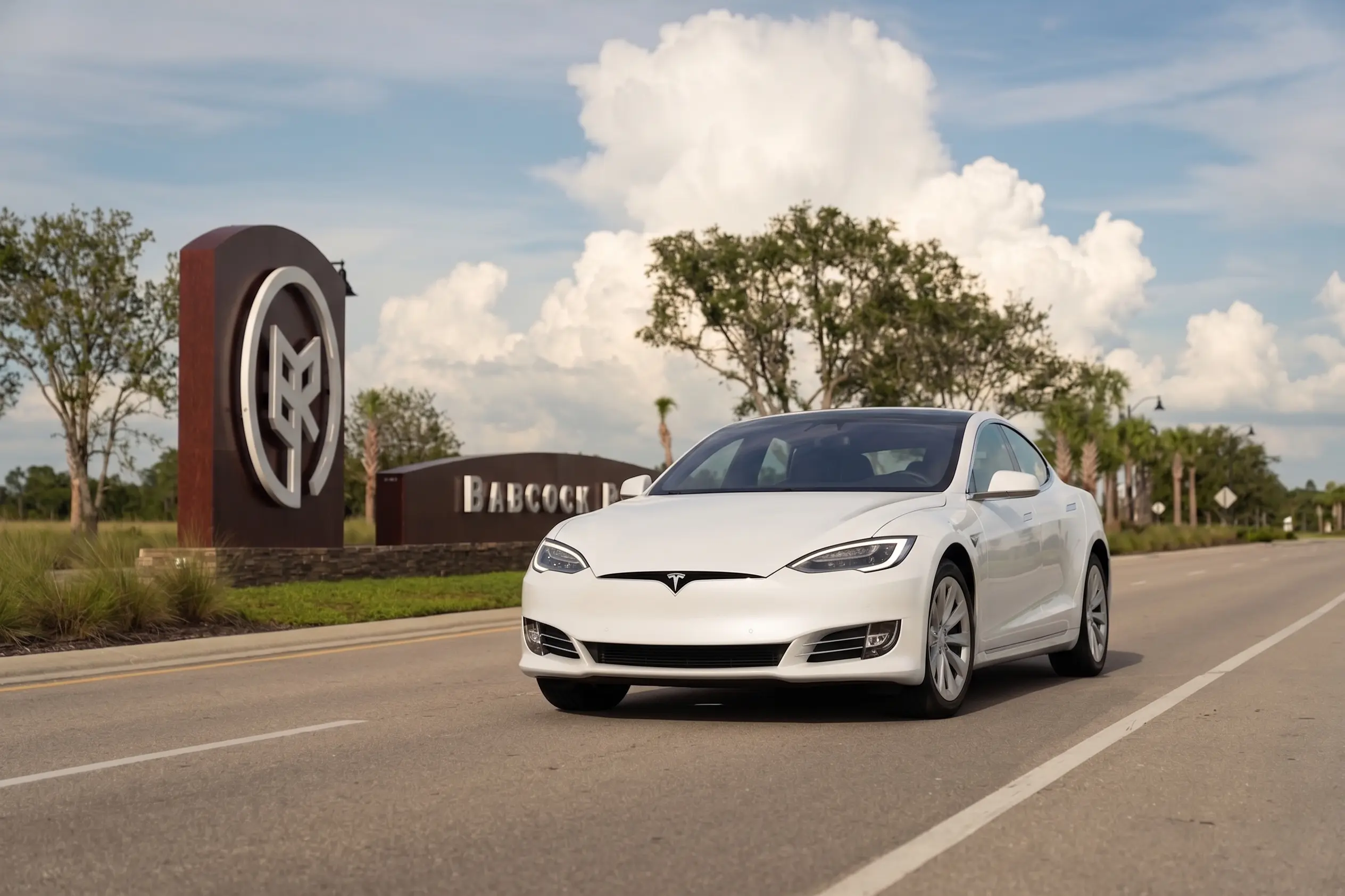 babcock_ranch_auto_insurance_on_B_street_tesla_model_S_entrance_sign